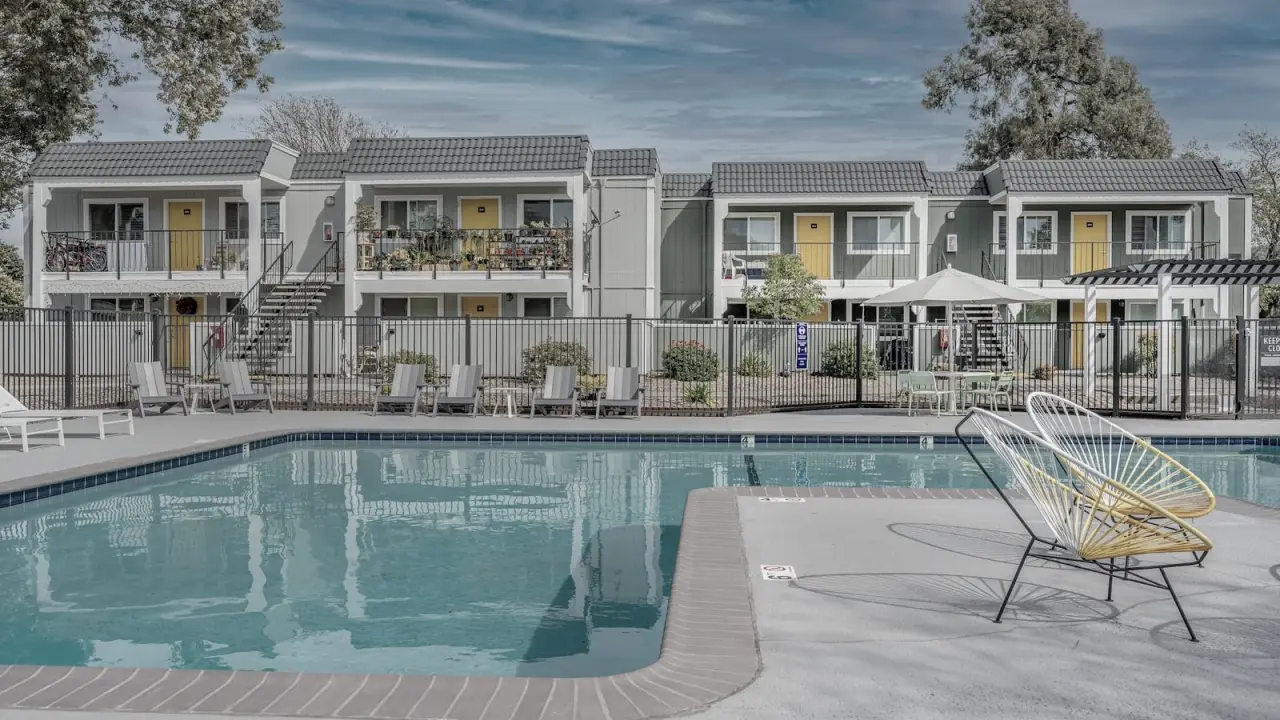 A landscaped courtyard and pool at an IEC-repositioned apartment community.